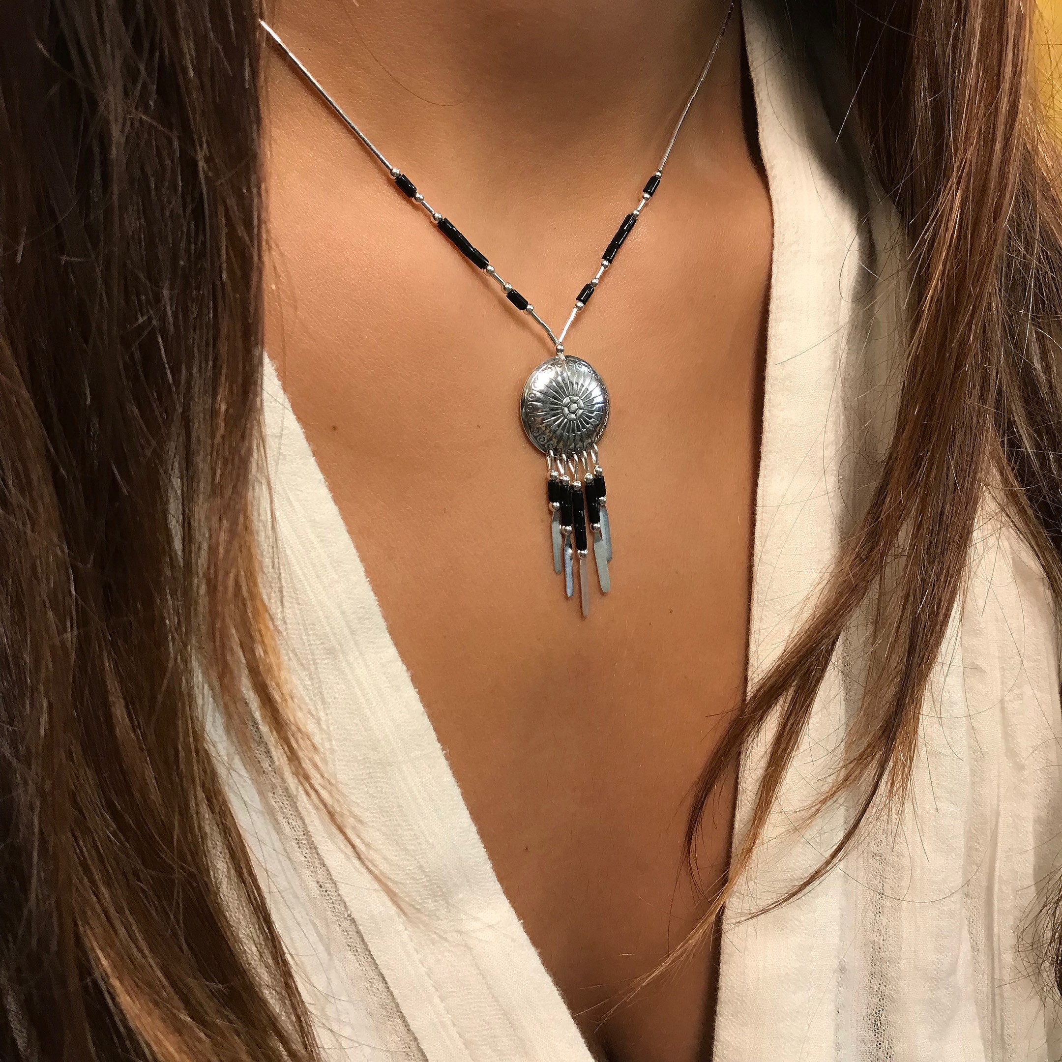 "Native American concho necklace made of Heishi beads. Harpo Paris"