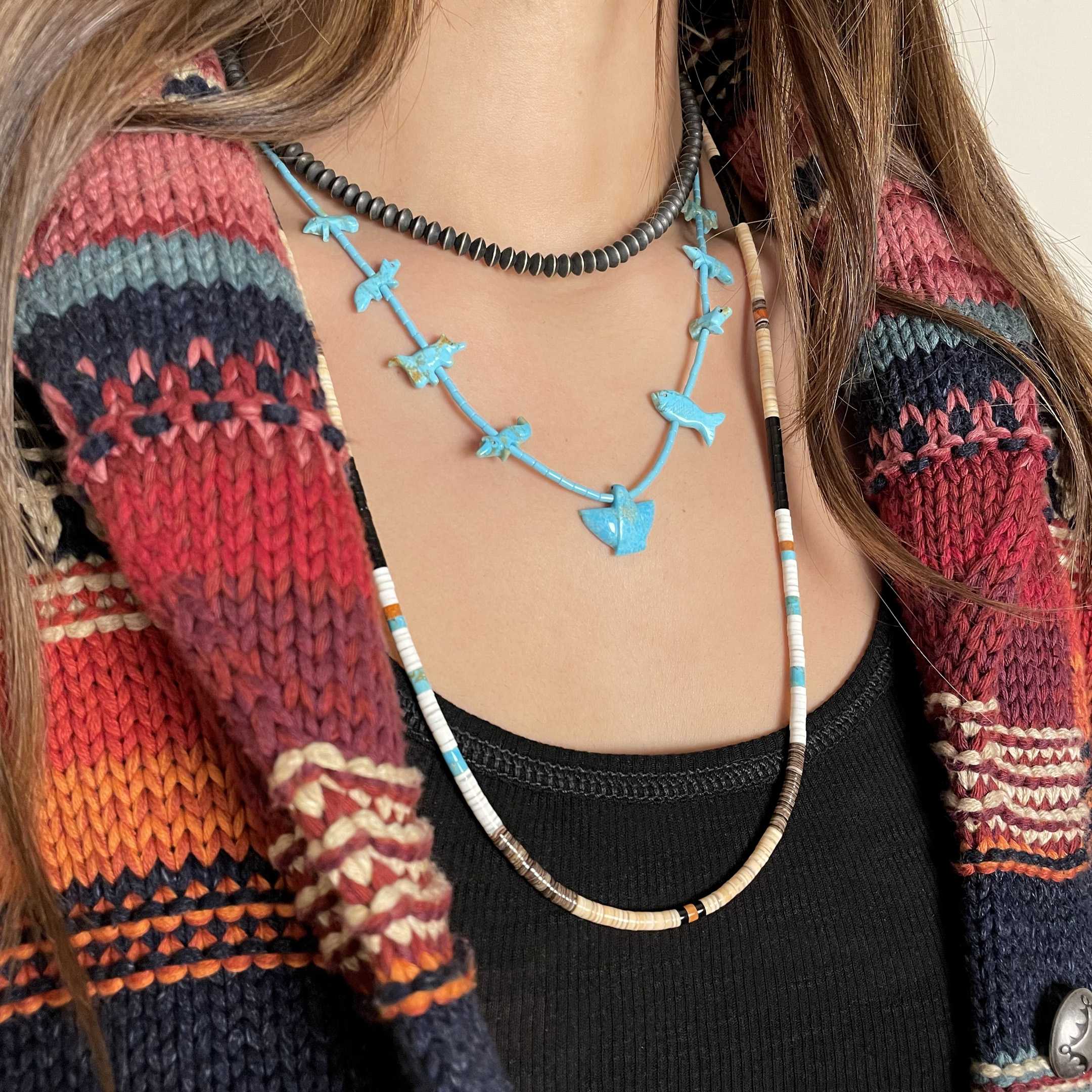 Fetishes necklace. Animals carved in turquoise on Heishi turquoise beads string.