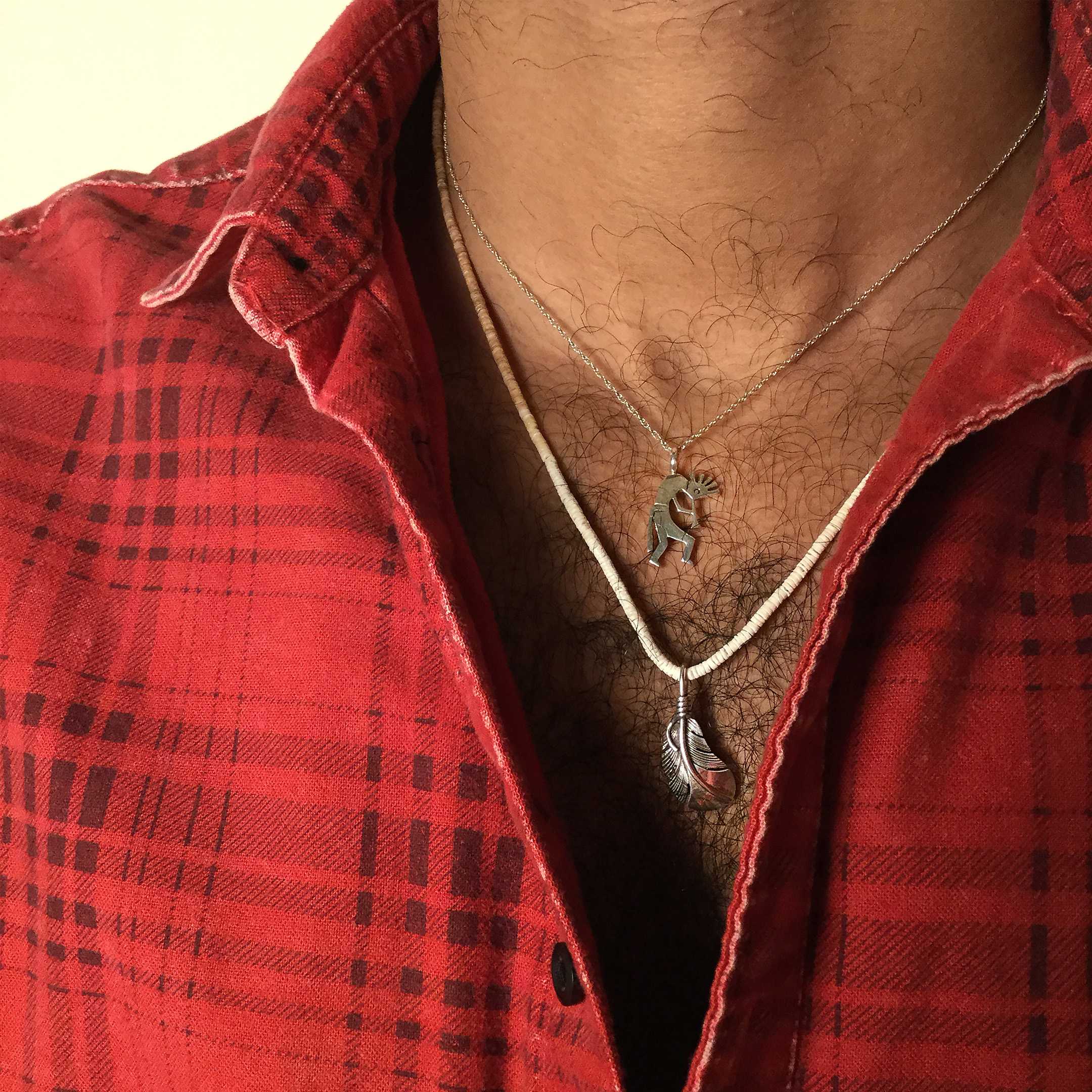 Navajo sterling silver pendant representing Kokopelli